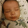 Wesley is registered to the contest to win money with this photo: baby, sleeping, infant, face, hair, pajamas, pattern, pillow, closeup, peaceful, child, cute, young, resting, cozy, indoor, portrait, soft_light, toddler, blanket