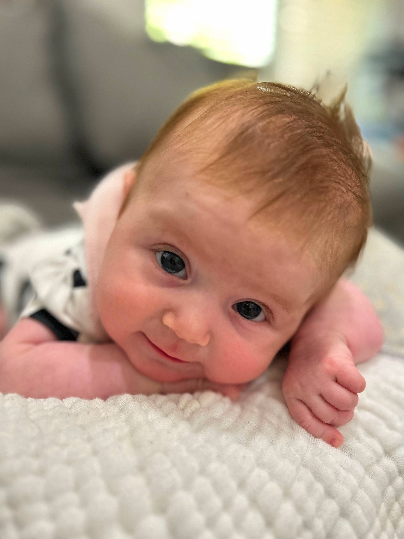 Callie is registered to the contest to win money with this photo: baby, baby_toddler_clothing, cheek, child, comfort, eyebrow, eyelash, finger, flooring, fun, happy, iris, linens, lip, mouth, nose, person, skin, thumb, toddler