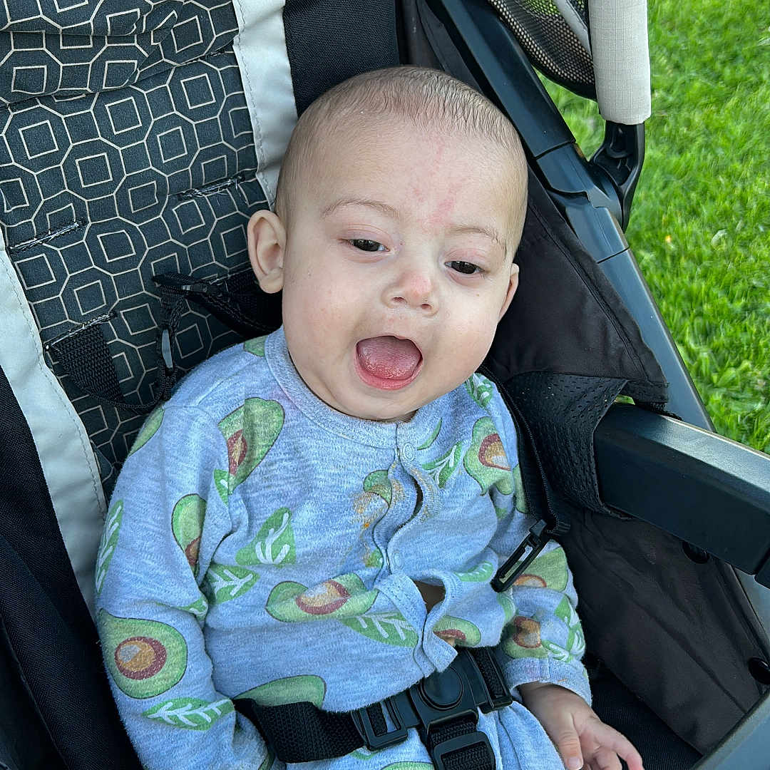 Luis joined the competition — help win amazing prizes! alloywheel, baby, babylaughing, car, car_interior, carseat, carwheel, face, happy, head, machine, person, photography, portrait, spoke, stroller, tire, transportation, vehicle, wheel