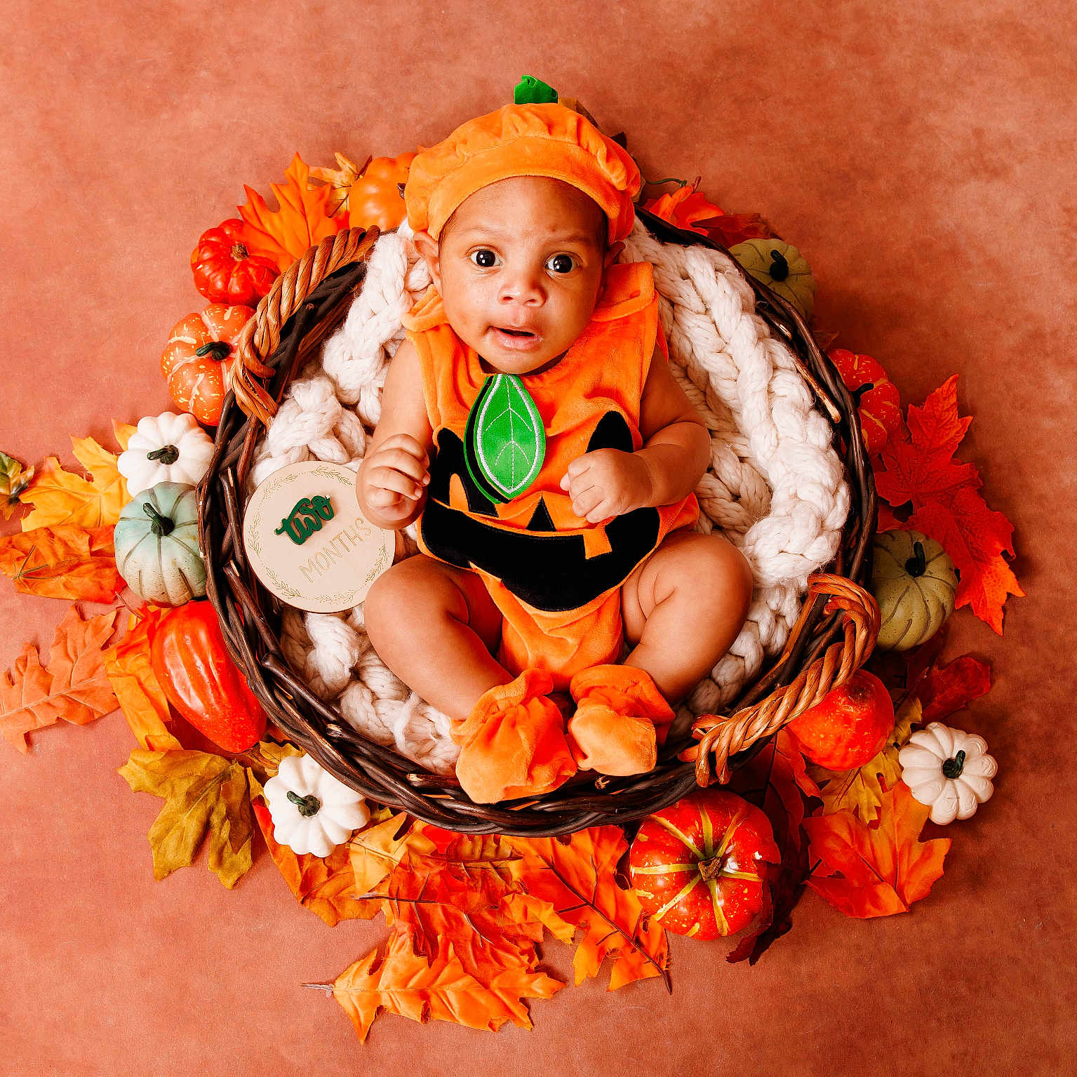 Leandrew is registered to the contest to win money with this photo: adorable, autumn_leaves, baby, basket, child, cozy, cute, decorative_pumpkins, fall_theme, festive, holiday, holiday_costume, infant, orange, portrait, pumpkin_costume, seasonal, sitting, smiling, soft_blanket