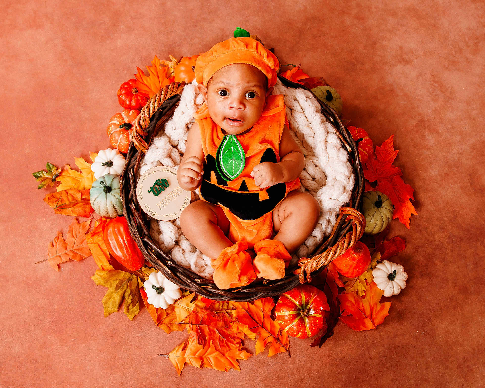 Leandrew is registered to the contest to win money with this photo: baby, pumpkin_costume, basket, autumn_leaves, decorative_pumpkins, orange, fall_theme, infant, cute, portrait, holiday, seasonal, cozy, soft_blanket, holiday_costume, child, festive, smiling, sitting, adorable