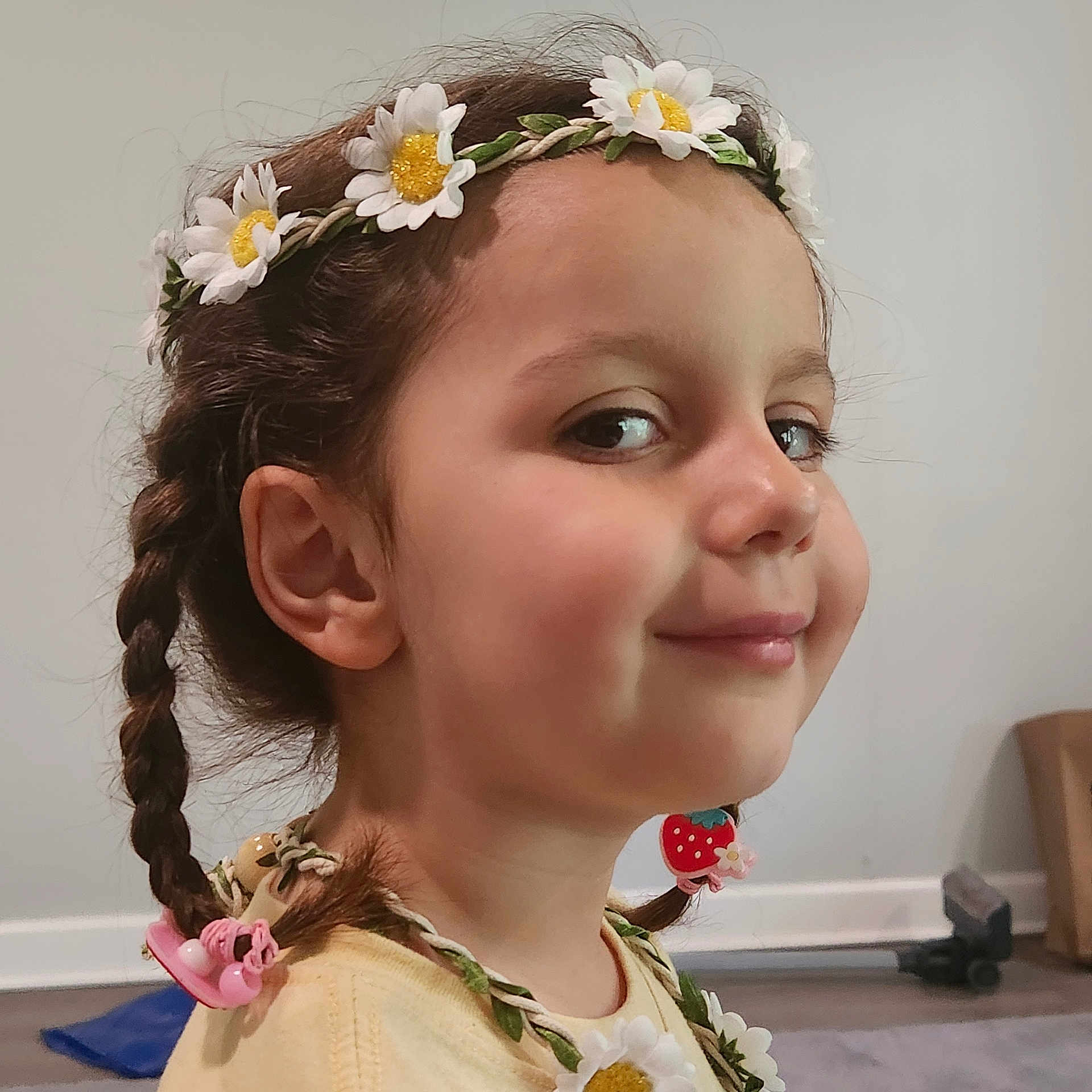 Ekin Gökçe joined the competition — help win amazing prizes! accessory, braids, child, clothing, cute, daisy, face, flower_crown, girl, hair, hair_accessories, happy, head, indoor, person, playful, portrait, smile, strawberry, young