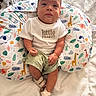 Aziel joined the competition — help win amazing prizes! baby, child, infant, cushion, animal_pattern, shirt, shorts, sandals, face, hands, legs, footwear, indoor, bedspread, cute, portrait, sitting, colorful, fabric, person