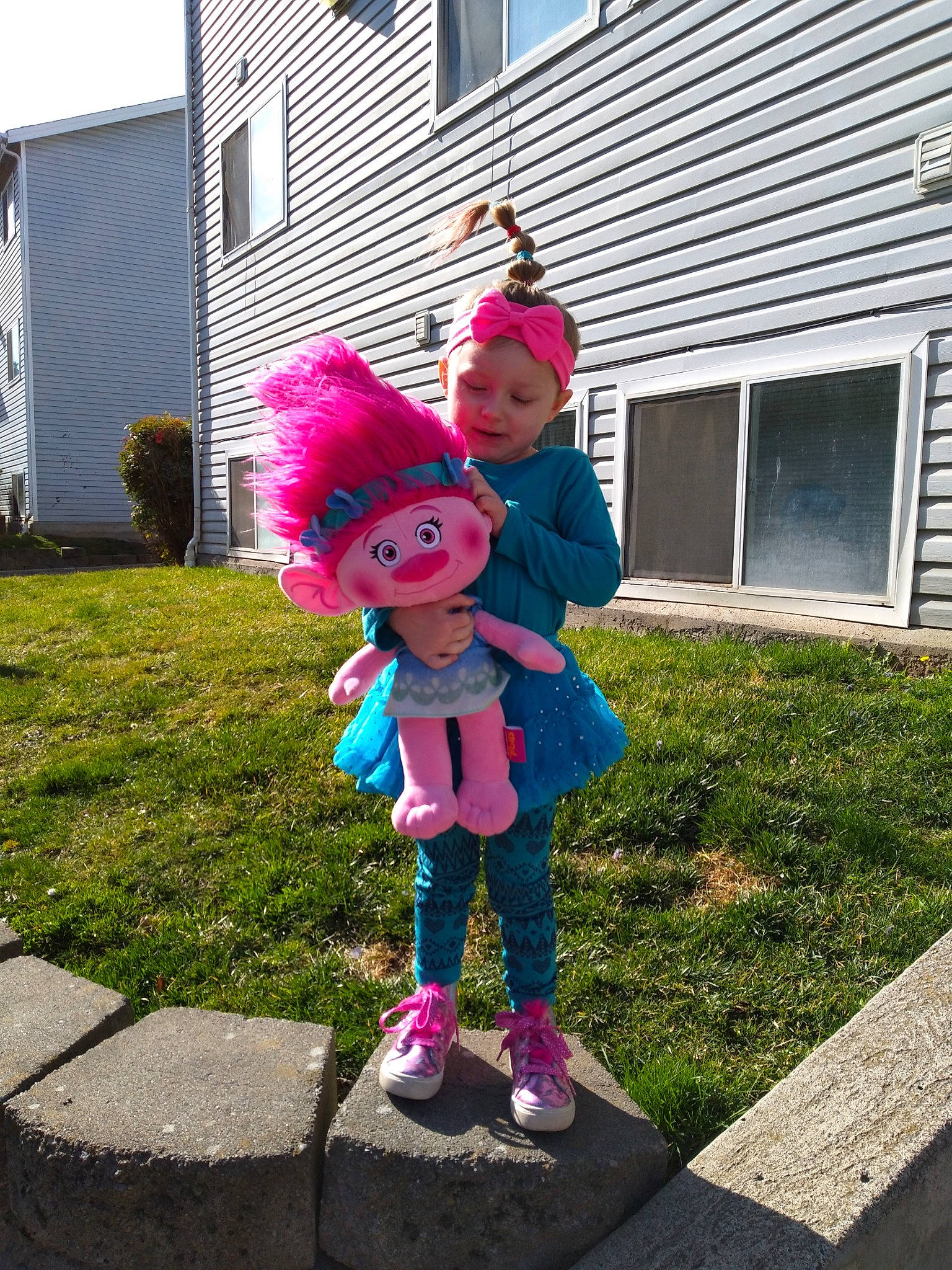 Wednesday is registered to the contest to win money with this photo: child, costume, headwear, house, lawn_ornament, mascot, person, pink