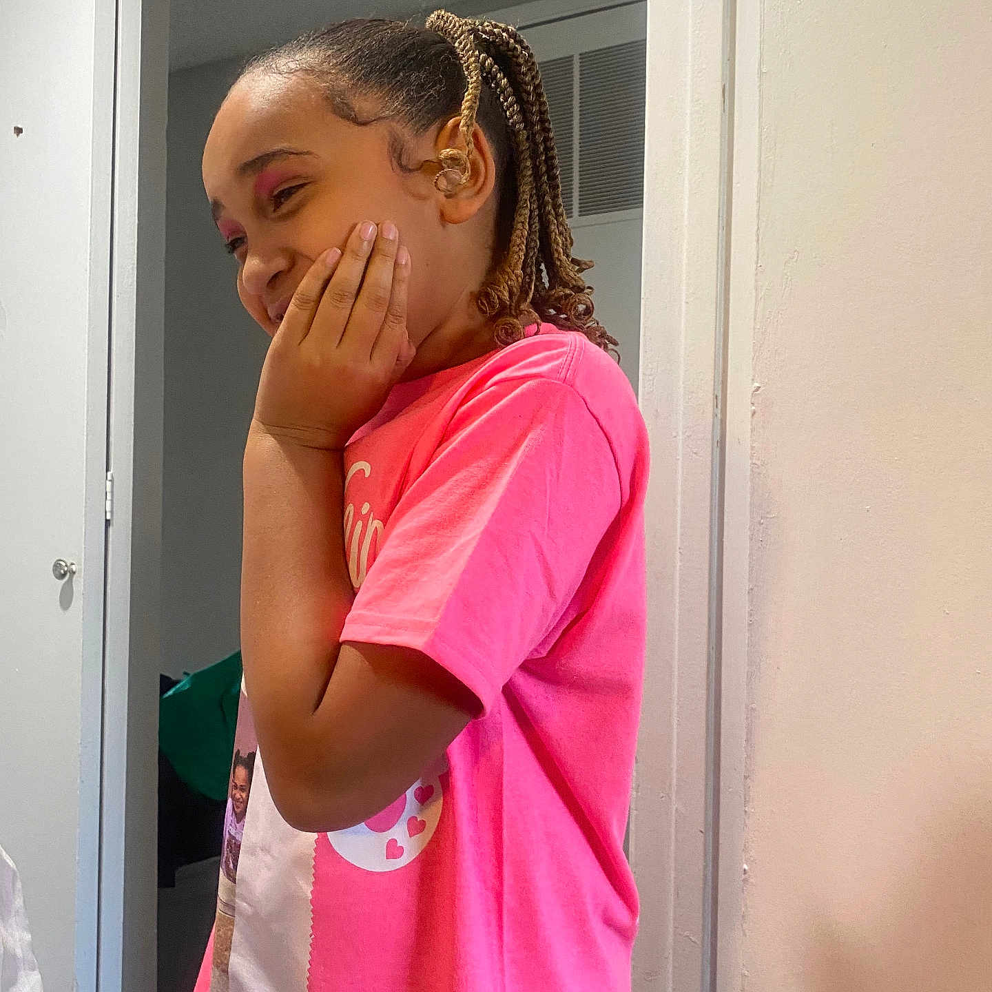 Jaliyiah joined the competition — help win amazing prizes! braided_hair, casual_clothing, cheek, child, door, expression, eyeshadow, face, girl, hairstyle, hand, happy, indoor, person, pink_shirt, portrait, skin, smiling, wall, young