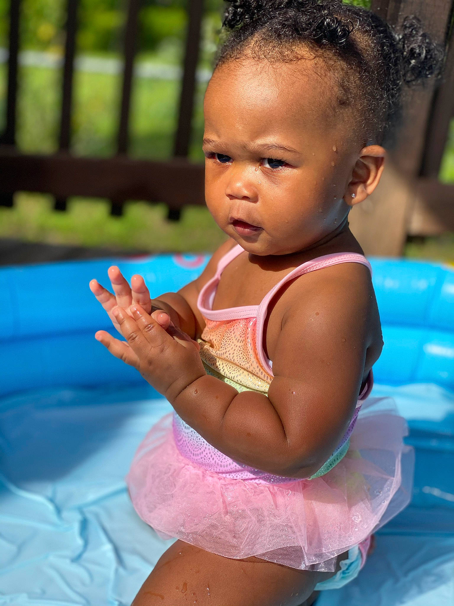 Ania is registered to the contest to win money with this photo: baby, black_hair, child, face, fun, games, happy, leisure, person, play, recreation, skin, smile, summer, swimming_pool, swimwear, toddler, vacation, water