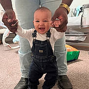 Suede joined the competition — help win amazing prizes! baby, infant, smiling_baby, overalls, denim, adult_hands, supporting, first_steps, boots, jeans, carpet, nursery, crib, toy_bag, indoor, family_moment, happy, portrait, cute, toddler