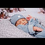 baby, blanket, blue_clothes, blue_hat, child, cozy, cute, face, headwear, indoors, infant, newborn, peaceful, portrait, resting, sleeping, snug, soft_texture, toddler, warm