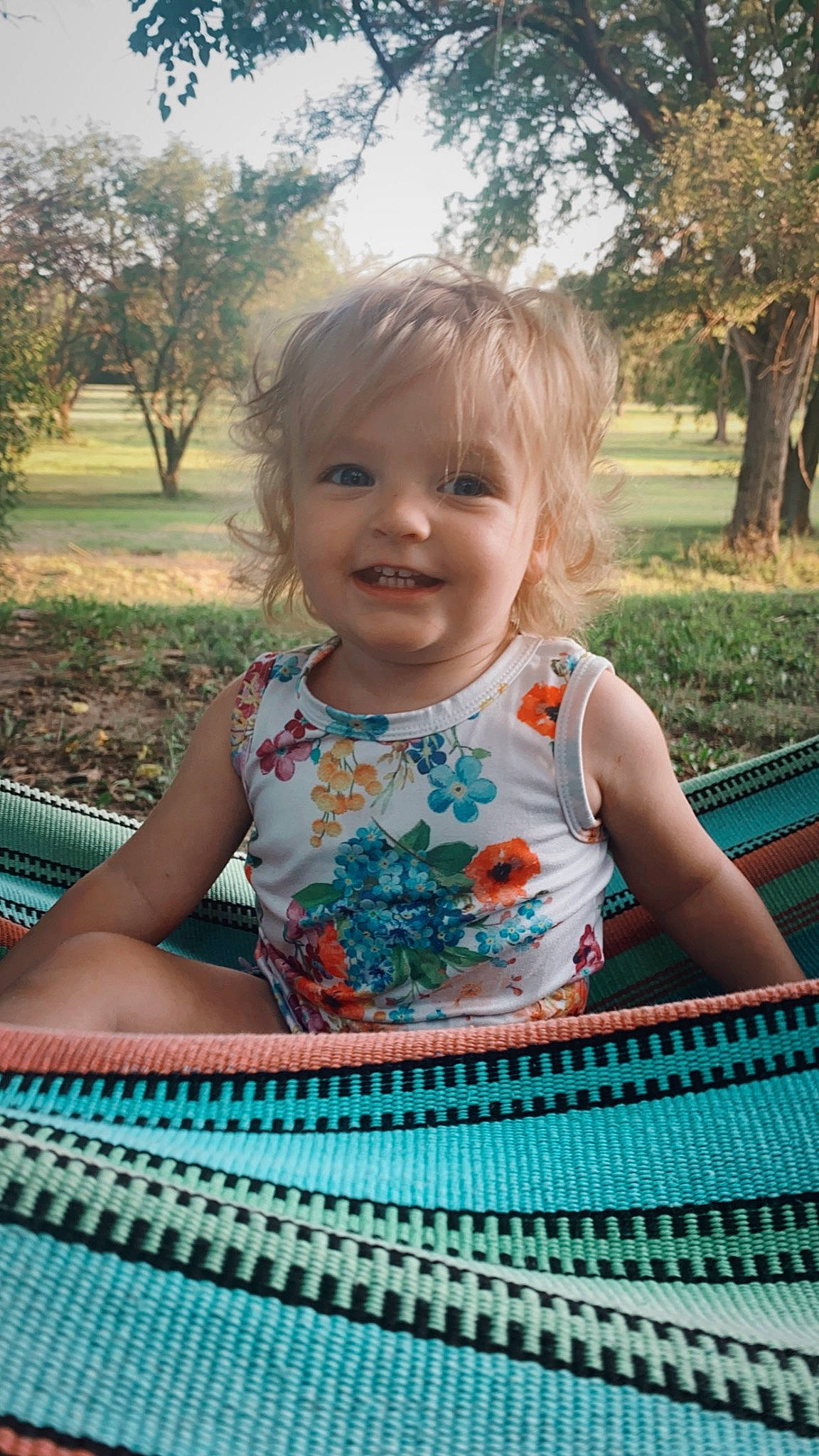 Eva is registered to the contest to win money with this photo: baby, baby_toddler_clothing, beauty, child, facial_expression, fun, grass, green, happy, iris, joy, leisure, person, pink, plant, recreation, skin, sky, smile, summer