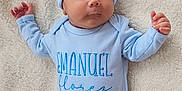 Emanuel joined the competition — help win amazing prizes! baby, sleeping, blue_clothing, hat, onesie, blanket, infant, soft_texture, peaceful, cute, newborn, foot, hand, portrait, child, resting, cozy, indoors, fabric, person