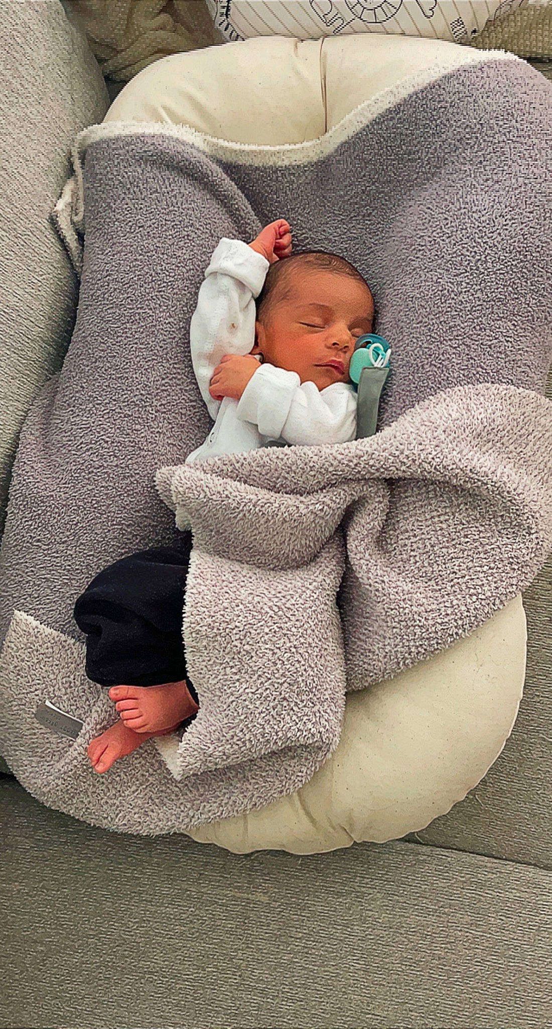 Kobe is registered to the contest to win money with this photo: baby, baby_products, baby_sleeping, baby_toddler_clothing, child, comfort, human_body, human_leg, linens, nap, pattern, person, room, sitting, skin, sleeve, sock, t_shirt, textile, toddler