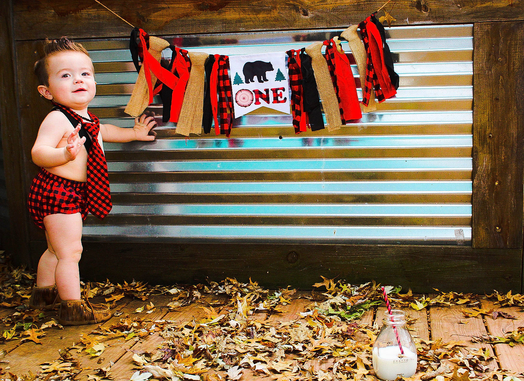 Tennessee is registered to the contest to win money with this photo: font, fun, grass, green, happy, landscape, leisure, light, line, pattern, people_in_nature, person, rectangle, red, t_shirt, tints_and_shades, toddler, tree, white, wood