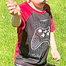 child, boy, outdoor, grass, sunlight, smiling, short_hair, tshirt, shorts, gaming_theme, carrot, playful, nature, casual_clothing, summer, happy, person, standing, daylight, fun