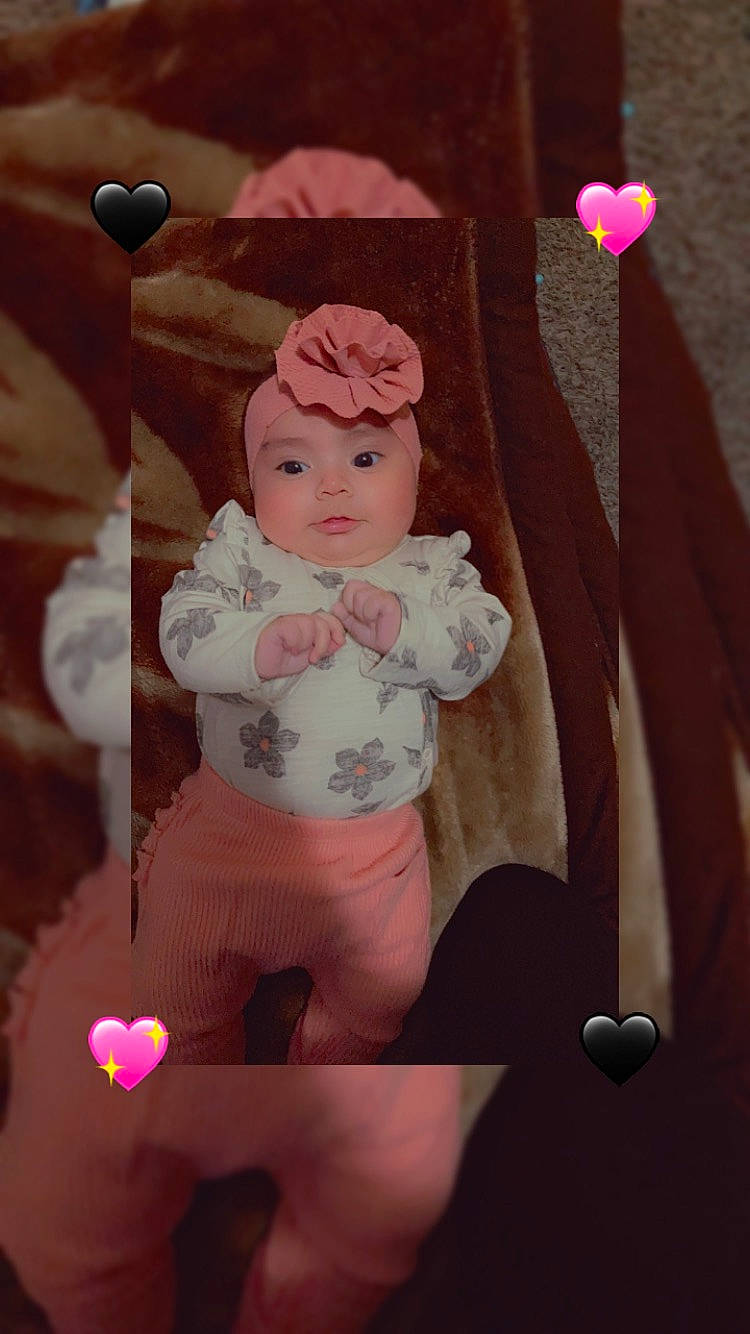 Isela joined the competition — help win amazing prizes! abdomen, art, baby, baby_products, chest, child, doll, happy, headwear, human_leg, magenta, navel, peach, person, pink, room, skin, textile, thigh, toddler