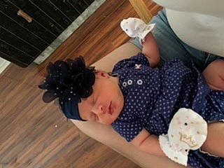 Jersey is registered to the contest to win money with this photo: baby, child, design, finger, flooring, headwear, leg, pattern, person, thumb, toddler