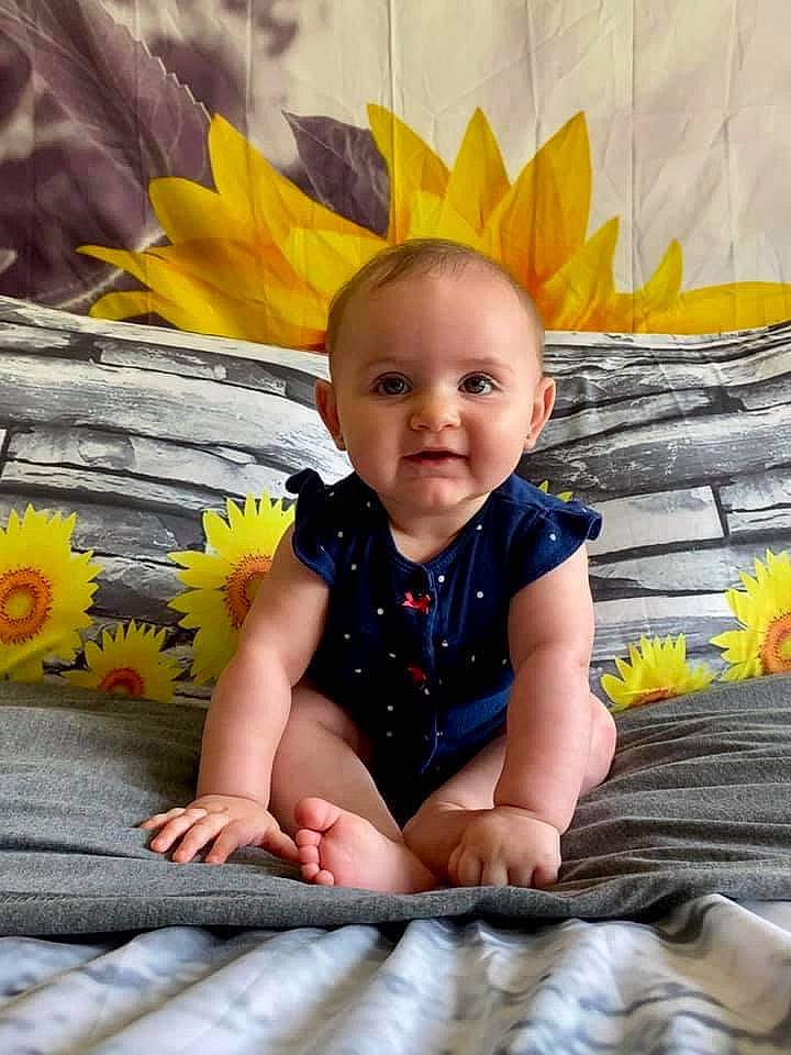 Charlotte joined the competition — help win amazing prizes! baby, child, person, plant, sitting, smile, toddler, yellow