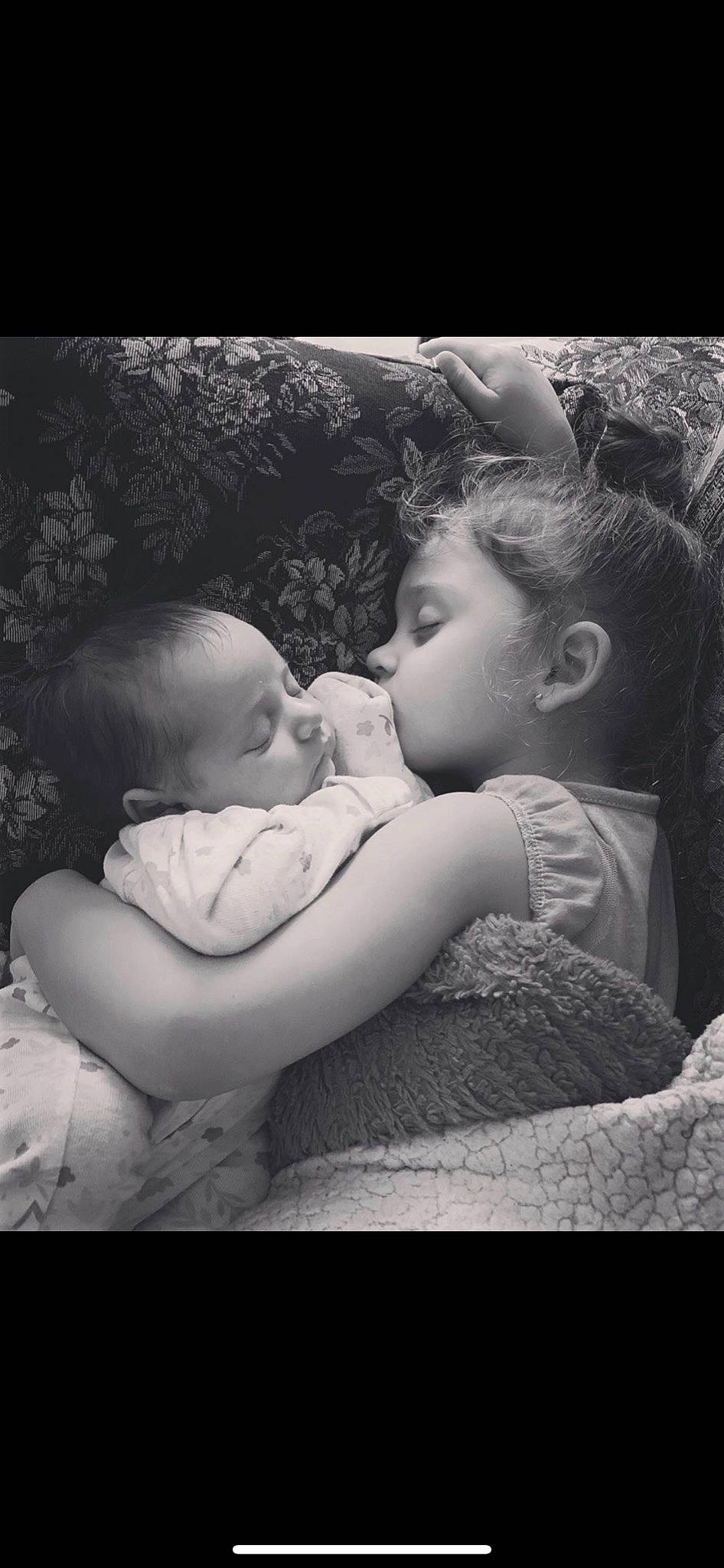 Charlotte is registered to the contest to win money with this photo: baby, black_and_white, child, gesture, love, monochrome, monochrome_photography, person, photograph, photography, portrait, sibling, snapshot, stock_photography, style