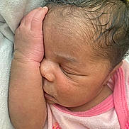 Lamauri Coleman joined the competition — help win amazing prizes! baby, child, closeup, cute, eyelashes, face, floral_pattern, hand, head, human, infant, newborn, peace, peaceful, pink_clothing, portrait, resting, skin, sleeping, soft