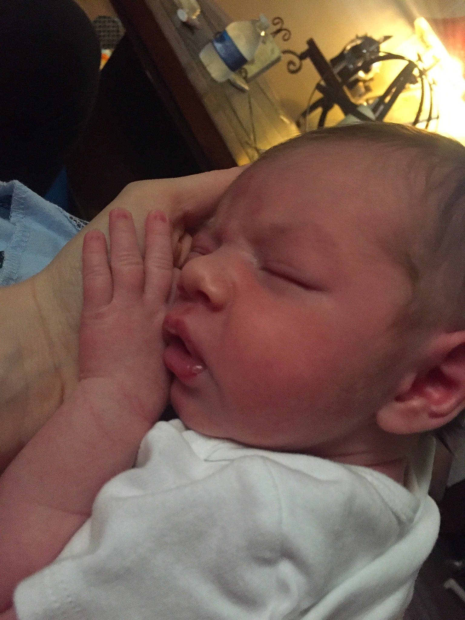 River is registered to the contest to win money with this photo: baby, birth, cheek, child, childbirth, chin, ear, electronic_device, eye, face, finger, forehead, hand, head, lip, mouth, nose, person, skin, sleep