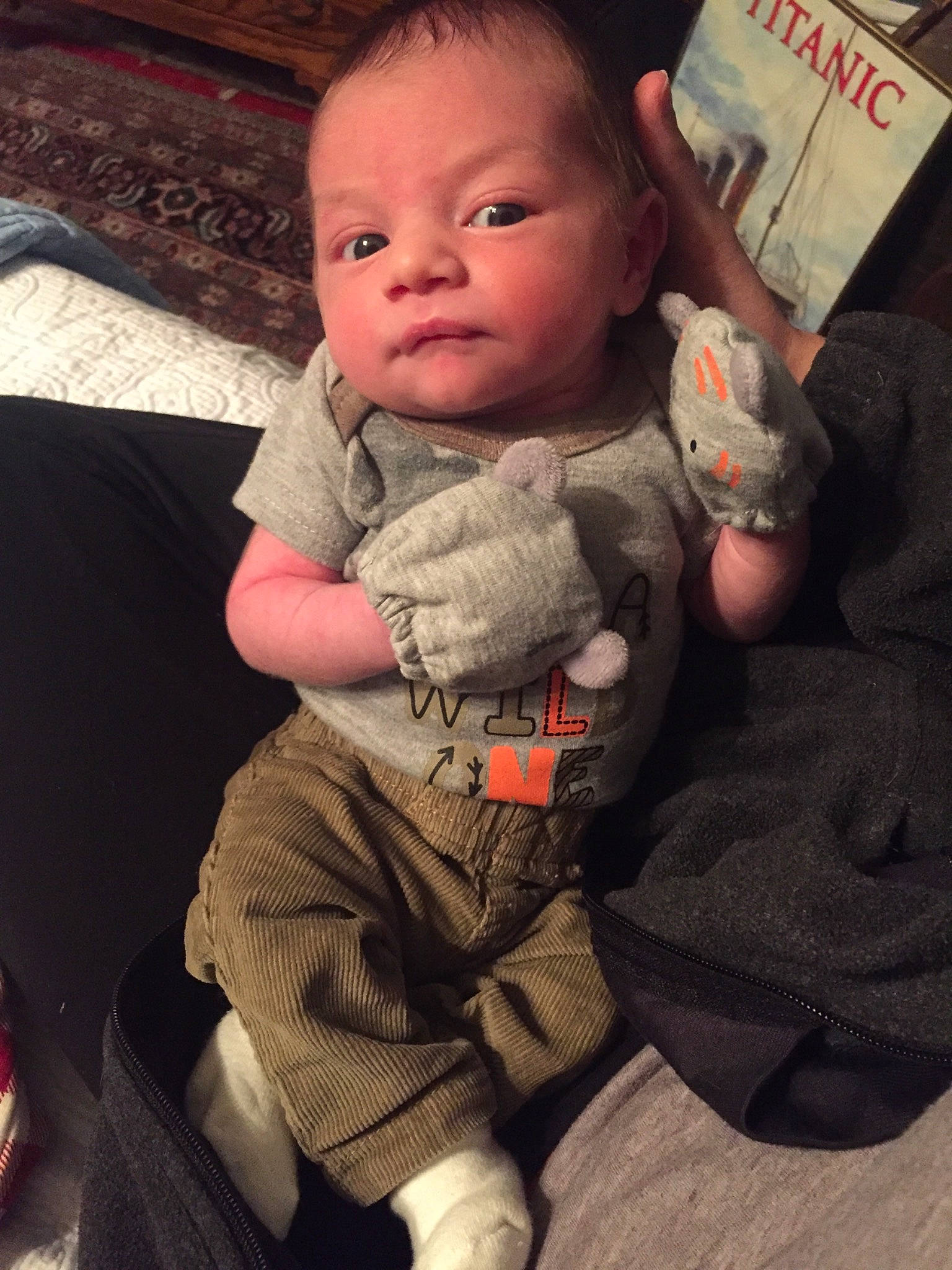 River is registered to the contest to win money with this photo: baby, baby_carriage, baby_in_car_seat, baby_products, cheek, child, eye, person, product, sitting, skin, sleeve, toddler