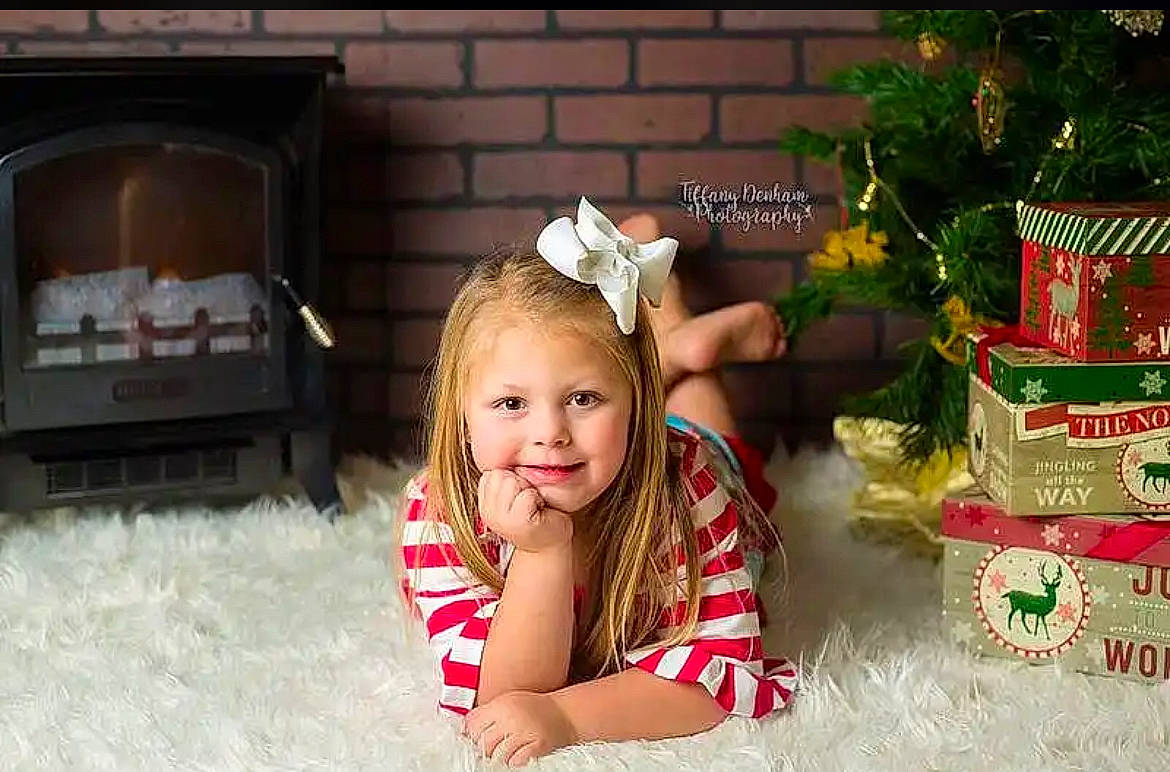 Kinsey joined the competition — help win amazing prizes! child, christmas, christmas_decoration, christmas_eve, christmas_ornament, conifer, event, evergreen, eye, happy, holiday, holiday_ornament, joy, ornament, person, plant, sitting, smile, toddler, tradition