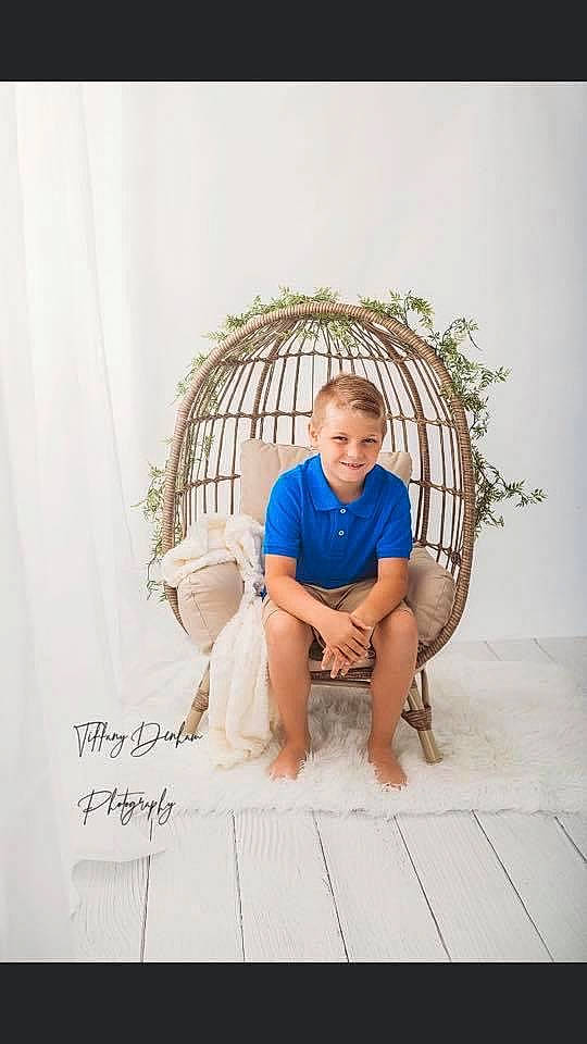 Colby joined the competition — help win amazing prizes! arch, chair, child, comfort, flooring, foot, fun, grass, house, joy, leisure, linens, pattern, person, product, room, shorts, sitting, sleeve, t_shirt