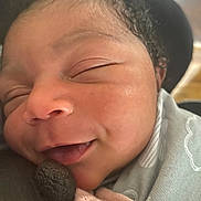 Aaliyah joined the competition — help win amazing prizes! baby, newborn, face, smile, curly_hair, sleepy, close_up, soft_clothing, skin, infant, cute, peaceful, child, portrait, tiny_hand, cozy, warm, adorable, resting, newborn_baby