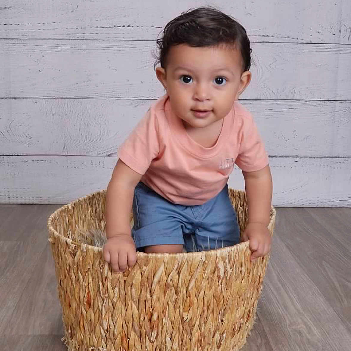 Mateo is registered to the contest to win money with this photo: art, baby, basket, clothing, crib, face, fun, furniture, handicraft, hardwood, head, infantbed, leisureactivities, person, picnic, shorts, sitting, sleeve, stainedwood, wood