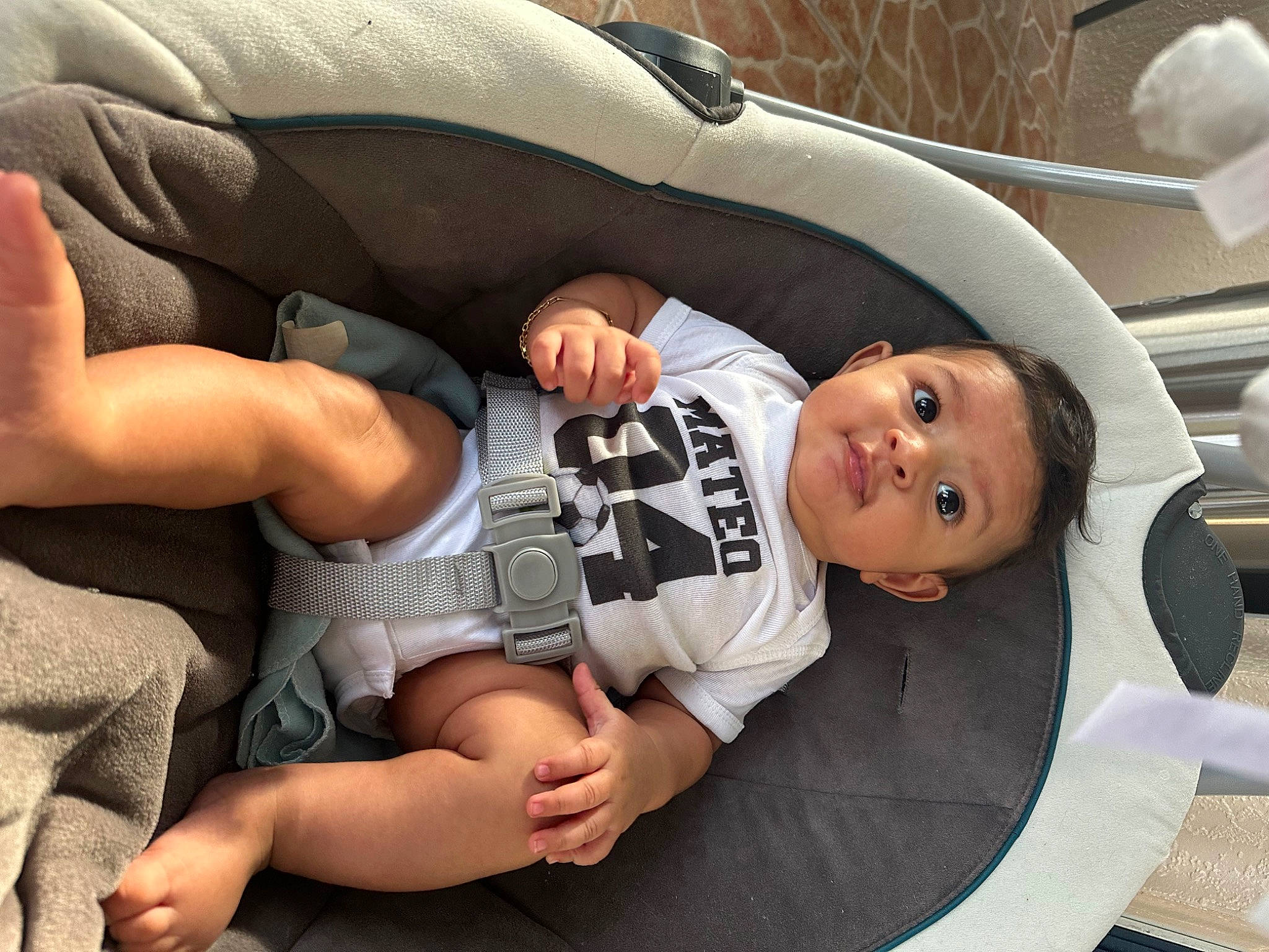 Mateo joined the competition — help win amazing prizes! automotive_exterior, baby, baby_products, baby_toddler_clothing, car_seat, child, comfort, elbow, family_car, finger, foot, gesture, human_leg, knee, person, shorts, sitting, thigh, thumb, toddler