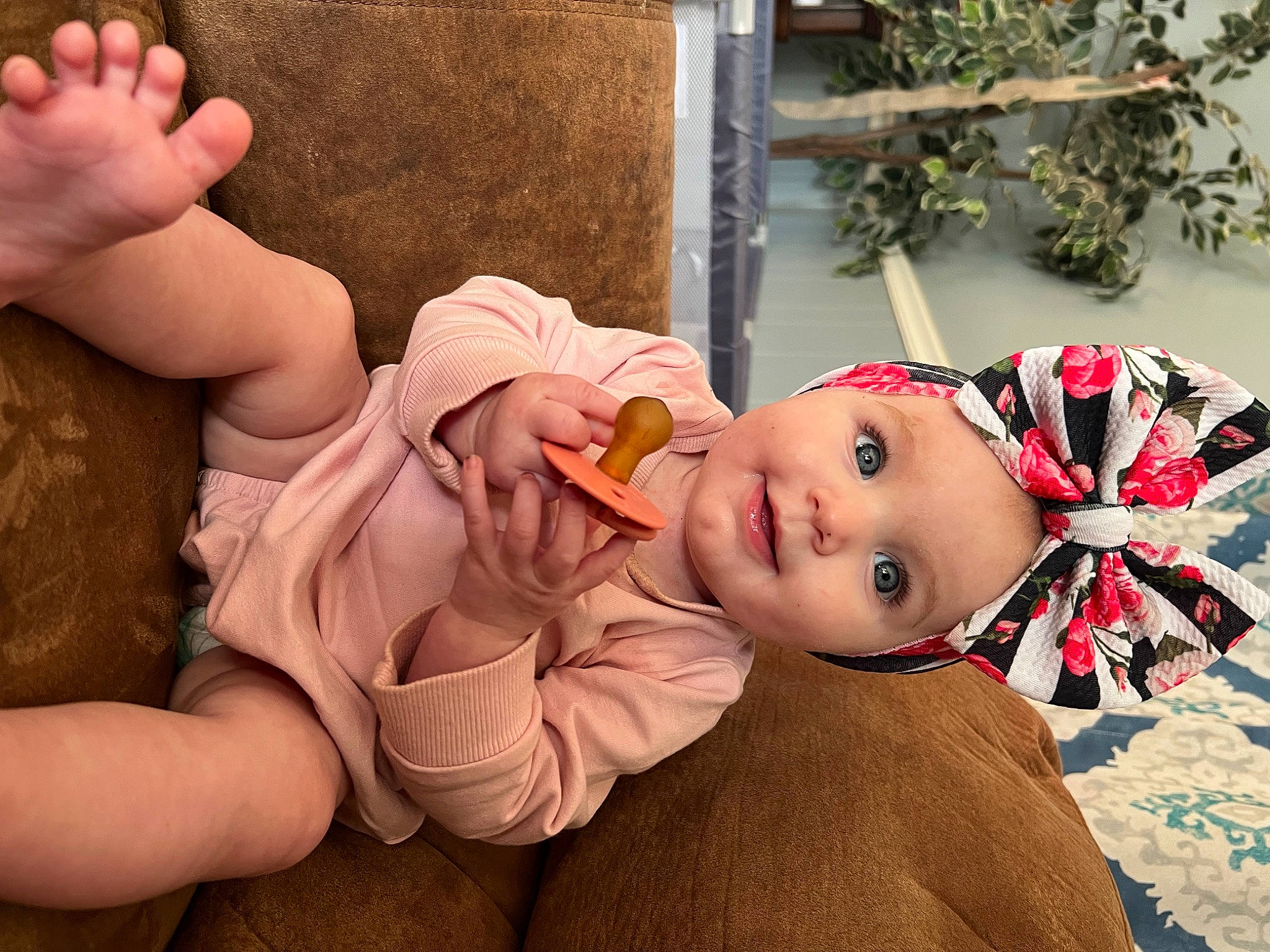 Brelyn joined the competition — help win amazing prizes! baby, baby_toddler_clothing, child, facial_expression, foot, fun, gesture, happy, hat, headwear, human_body, human_leg, joy, mouth, person, pink, plant, skin, smile, thumb