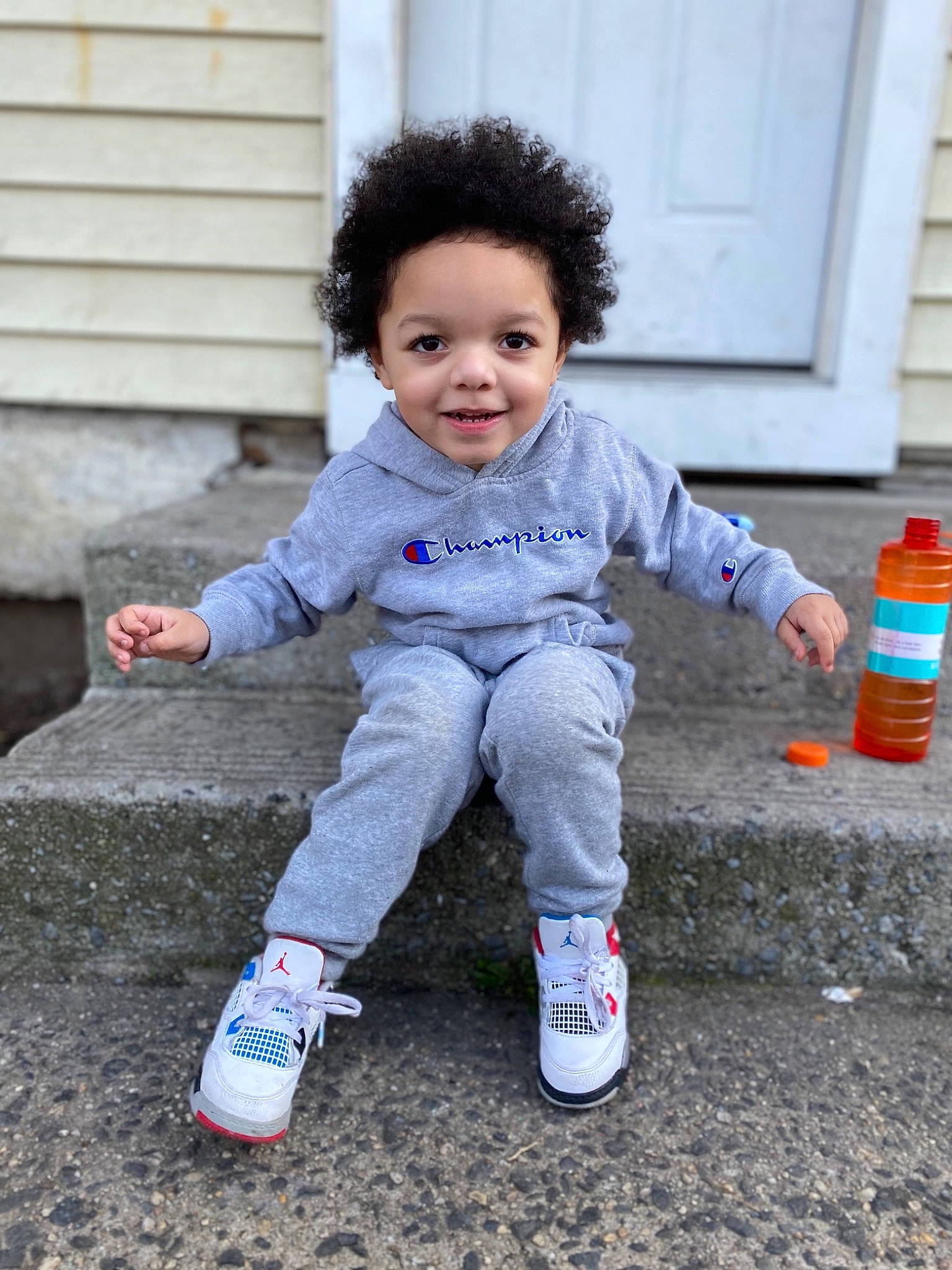 Victor is registered to the contest to win money with this photo: baby, child, joy, people, person, play, shoe, smile, standing, toddler