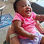 Xamira joined the competition — help win amazing prizes! baby, child, smiling, pink_shirt, purple_shorts, indoor, carpet, furniture, person, happy, hands, living_room, baby_gear, cute, infant, portrait, sitting, skin, closeup, human