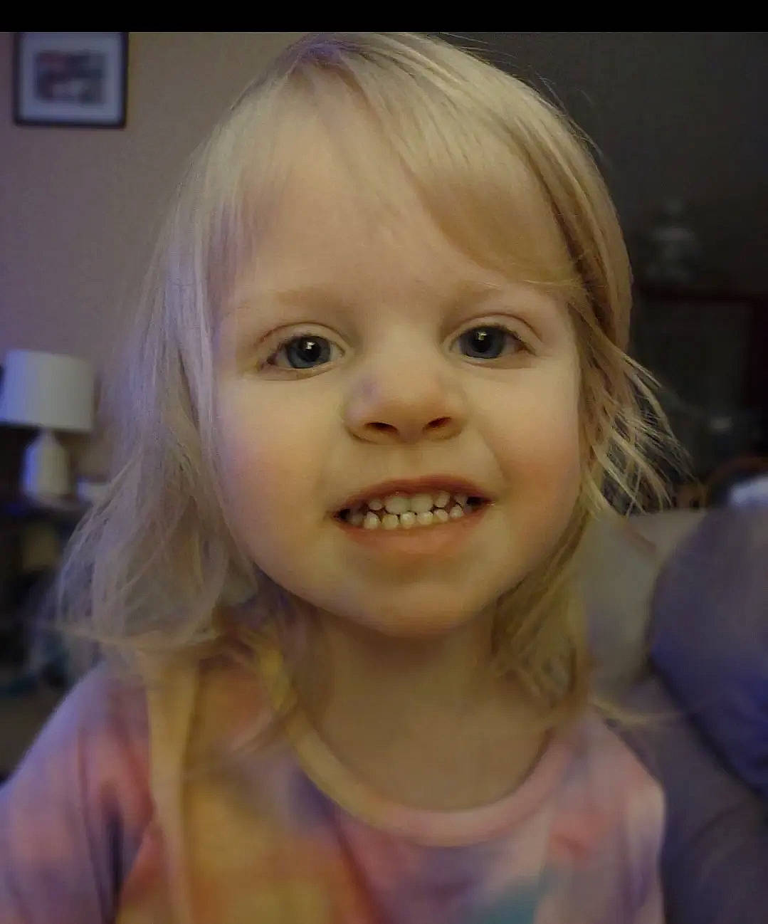 Josephine is registered to the contest to win money with this photo: bangs, blond, cheek, chin, ear, eye, eyebrow, eyelash, happy, iris, jaw, joy, lamp, layered_hair, lip, mouth, nose, person, picture_frame, smile