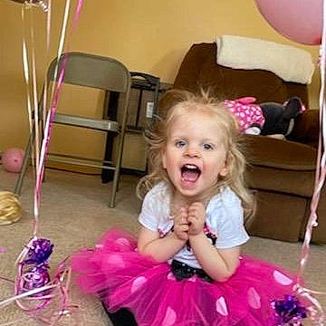 Josephine is registered to the contest to win money with this photo: baby_toddler_clothing, ballet_tutu, chair, dress, fashion, fun, furniture, hairstyle, happy, magenta, mammal, person, photograph, pink, product, purple, smile, snapshot, textile, toddler