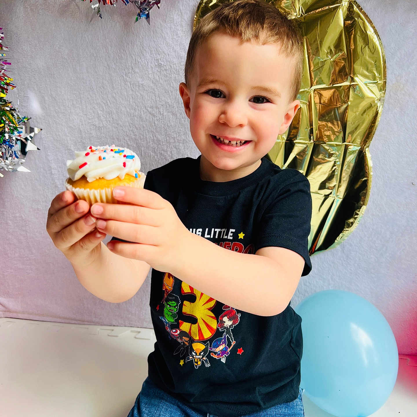 Asher joined the competition — help win amazing prizes! balloon, boy, cake, child, clothing, cream, cupcake, dessert, face, food, head, icecream, icing, male, pants, people, person, photography, portrait, sweets