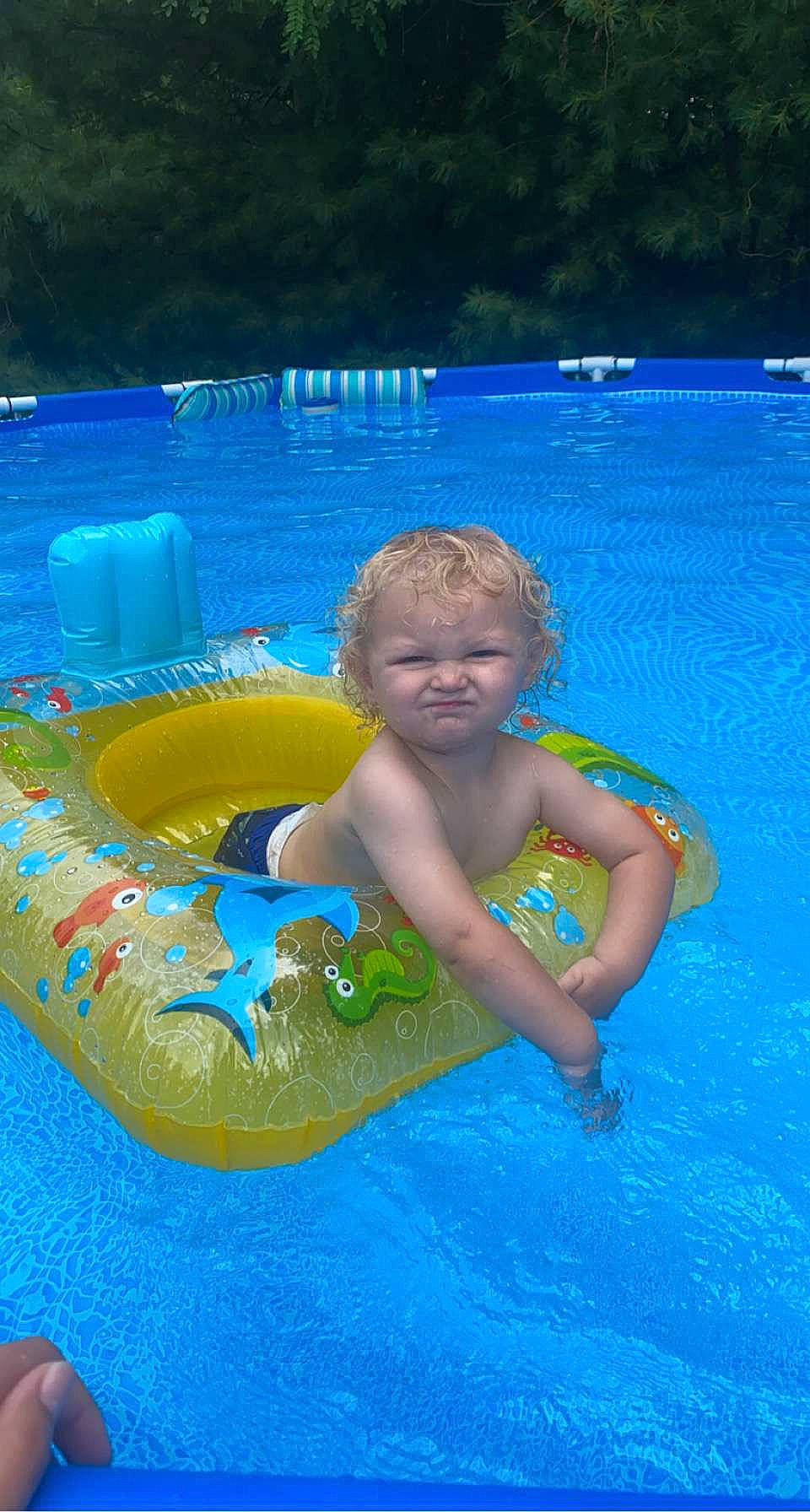 Carsen is registered to the contest to win money with this photo: aqua, azure, baby, bathing, blue, child, electric_blue, fluid, fun, games, happy, leisure, leisure_centre, nonbuilding_structure, outdoor_recreation, person, play, recreation, swimming_pool, toddler