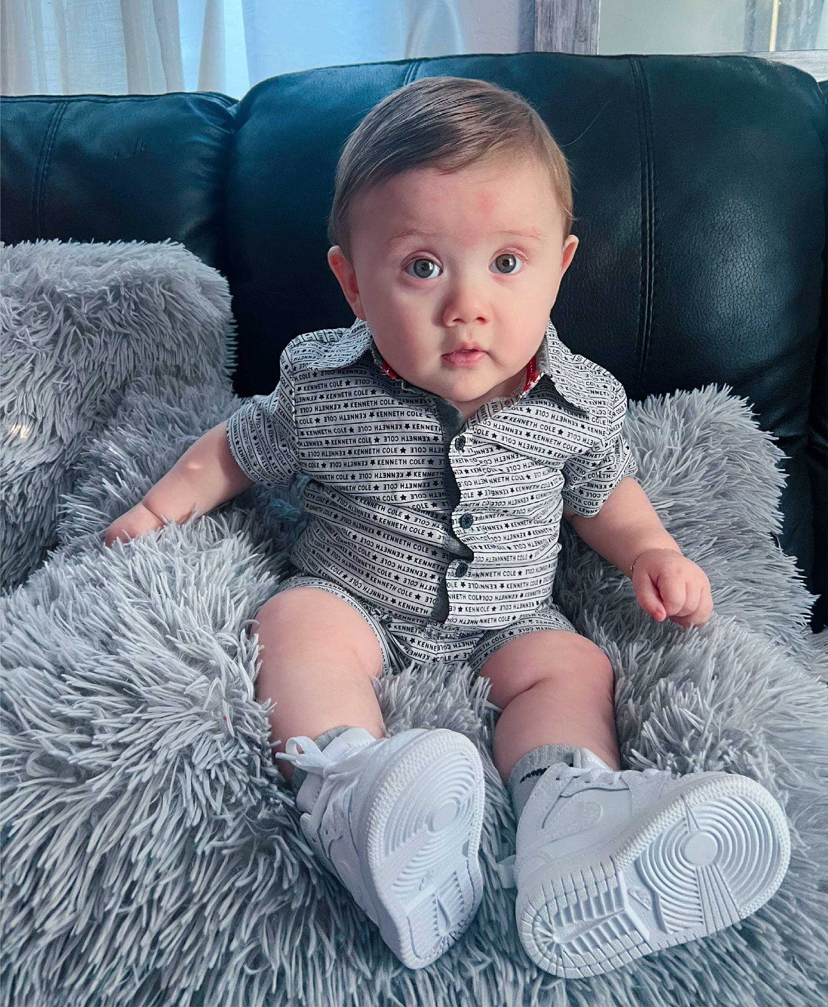 Kaleb joined the competition — help win amazing prizes! baby, baby_toddler_clothing, chair, child, comfort, couch, electric_blue, fur, human_leg, iris, pattern, person, shoulder, sitting, skin, sleeve, sock, standing, t_shirt, thigh