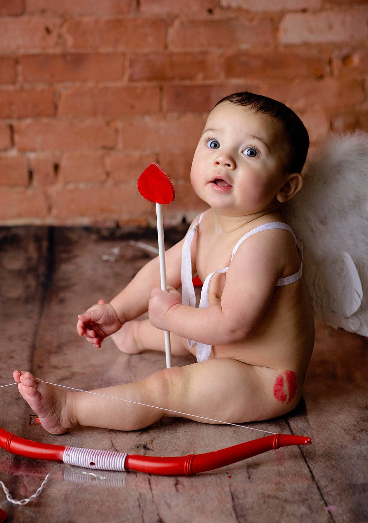 Avery is registered to the contest to win money with this photo: chest, child, chin, facial_expression, finger, flash_photography, foot, fun, happy, human_leg, joint, knee, lip, person, pink, sitting, skin, standing, thigh, toddler