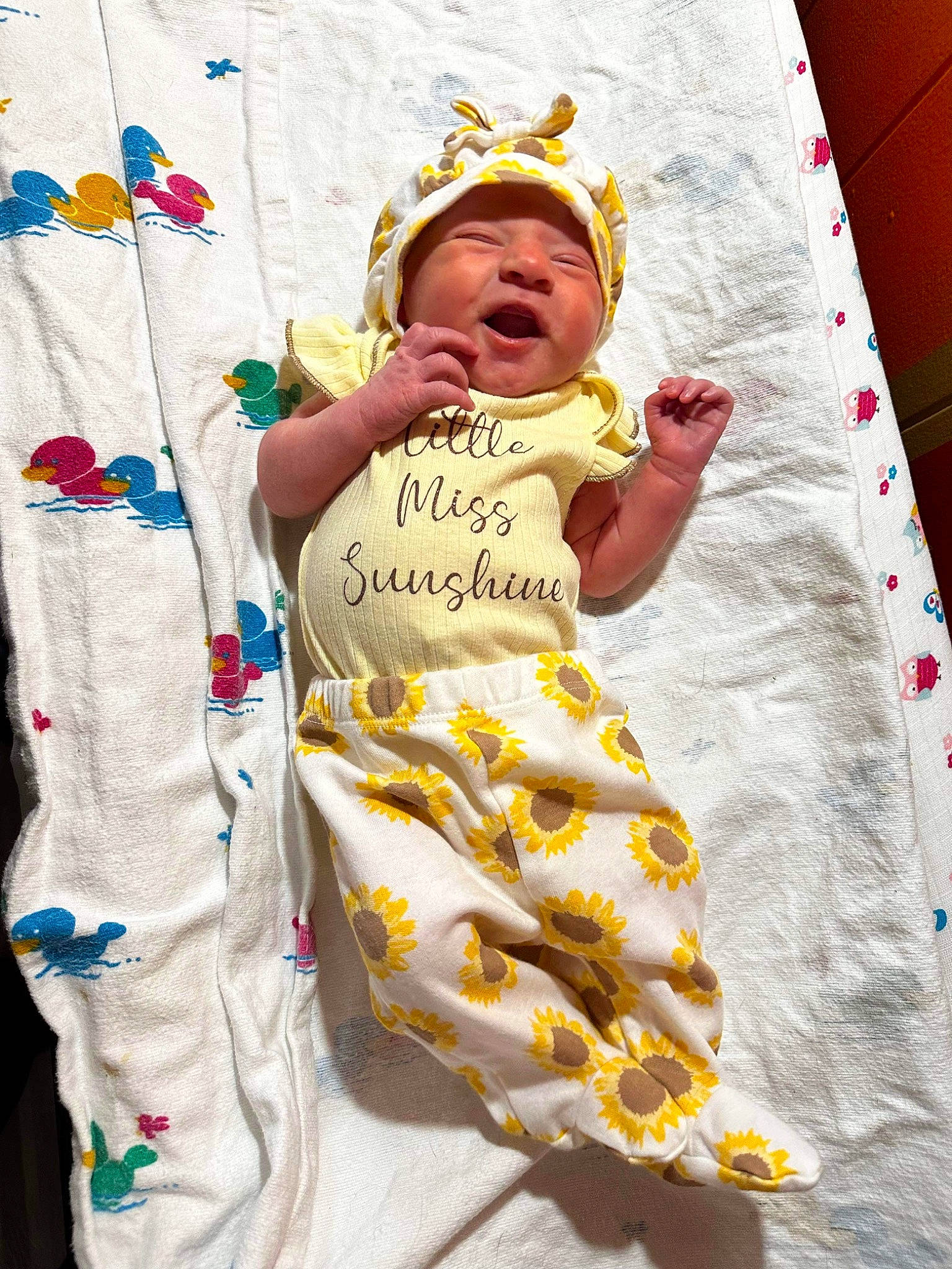 Saylor is registered to the contest to win money with this photo: baby, baby_toddler_clothing, cap, child, event, face, fashion_design, fun, happy, hat, headwear, leisure, linens, pattern, person, play, recreation, sleeve, t_shirt, textile