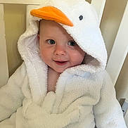Freddie joined the competition — help win amazing prizes! baby, child, towel, hood, duck, white, chair, face, blue_eyes, smile, cute, infant, soft, plush, indoors, person, clothing, happy, young, seated