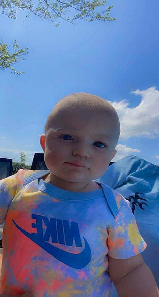 Conner is registered to the contest to win money with this photo: azure, baby, baby_toddler_clothing, child, cloud, cool, electric_blue, eyewear, facial_expression, fun, grass, happy, leisure, neck, nose, person, skin, sky, sleeve, t_shirt