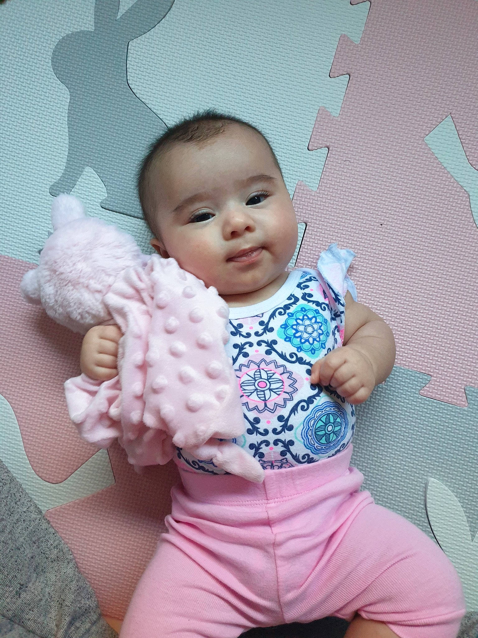 Layla is registered to the contest to win money with this photo: baby, baby_products, baby_toddler_clothing, cheek, child, head, outerwear, person, pink, product, skin, sleeve, smile, toddler