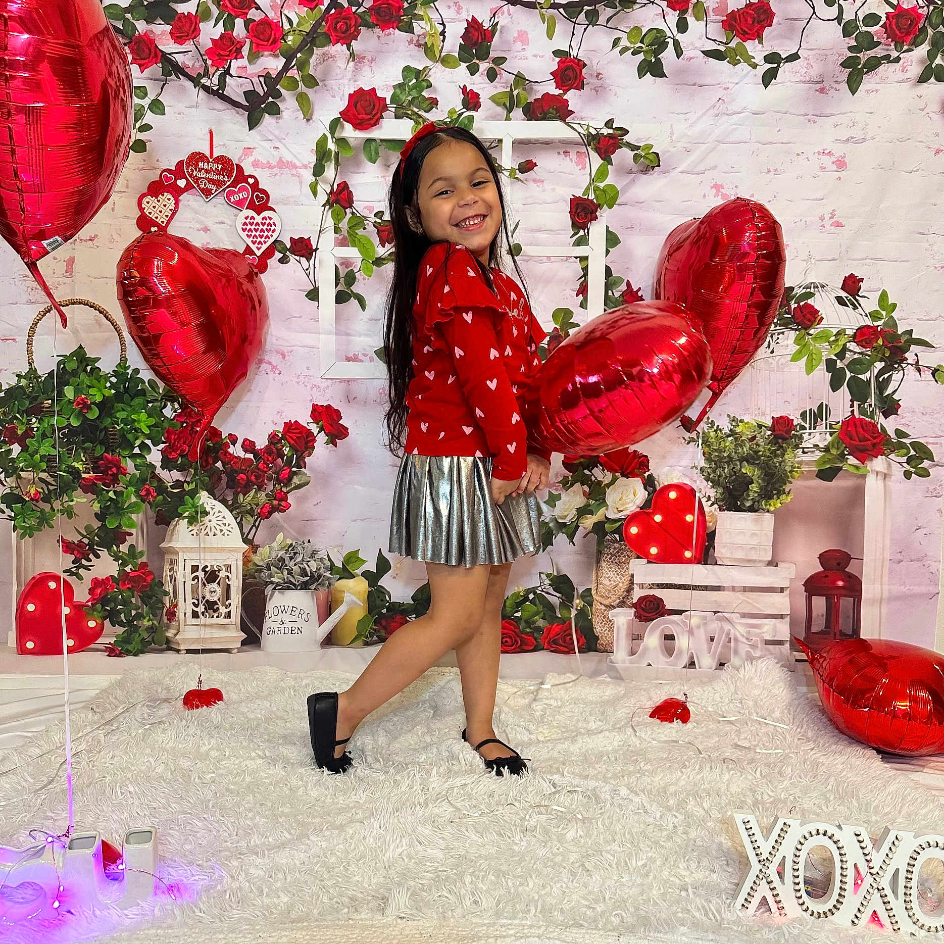 Emma joined the competition — help win amazing prizes! balloon, carpet, child, cute, decor, flowers, girl, happy, headband, heart_shaped, indoor, long_hair, love, pose, red, roses, silver_skirt, smiling, valentines_day, xoxo