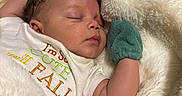 Javien joined the competition — help win amazing prizes! baby, sleeping, blanket, mittens, infant, cute, cozy, soft, clothing, face, peaceful, newborn, portrait, resting, child, warm, comfort, lying_down, cute_text, indoor