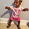 Kylie is registered to the contest to win money with this photo: toddler, child, pacifier, standing, pink_shorts, minnie_mouse, hair_buns, beads, sandals, indoor, wall, tile_floor, shadow, cute, playful, clothing, person, baby, portrait, smiling