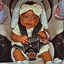 Myla joined the competition — help win amazing prizes! baby, car_seat, bow, headband, pacifier, plush_toy, blanket, infant, child, safety_harness, cute, smiling, indoor, seat, clothing, footwear, person, toddler, soft_toy, resting