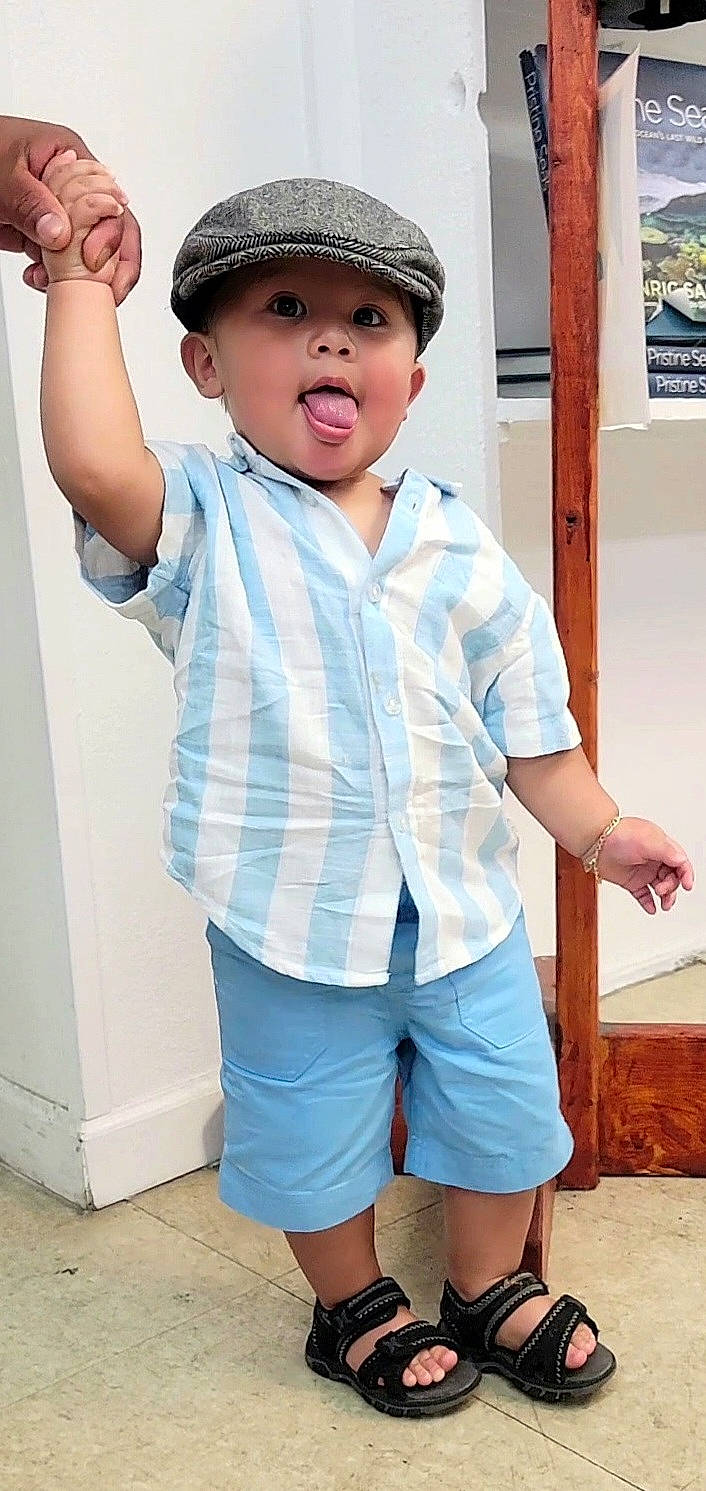 Liam joined the competition — help win amazing prizes! blue, clothing, cool, facial_expression, fashion, finger, flash_photography, gesture, happy, headwear, joint, muscle, person, photograph, shorts, shoulder, sleeve, standing, style, t_shirt