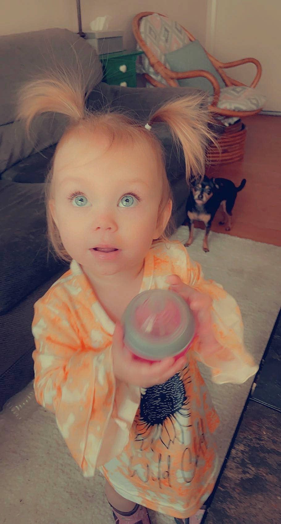 Delilah is registered to the contest to win money with this photo: beauty, child, cool, cup, dress, drinkware, eyelash, fawn, happy, lip, mammal, nail, organ, person, pink, skin, surprise, tableware, textile, toddler