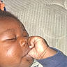 Princeton joined the competition — help win amazing prizes! baby, infant, sleeping, face, closed_eyes, fist, hand, sucking_fist, portrait, close_up, indoor, bed, bedding, quilt, textile, clothing, blue_sleeve, peaceful, resting, photograph