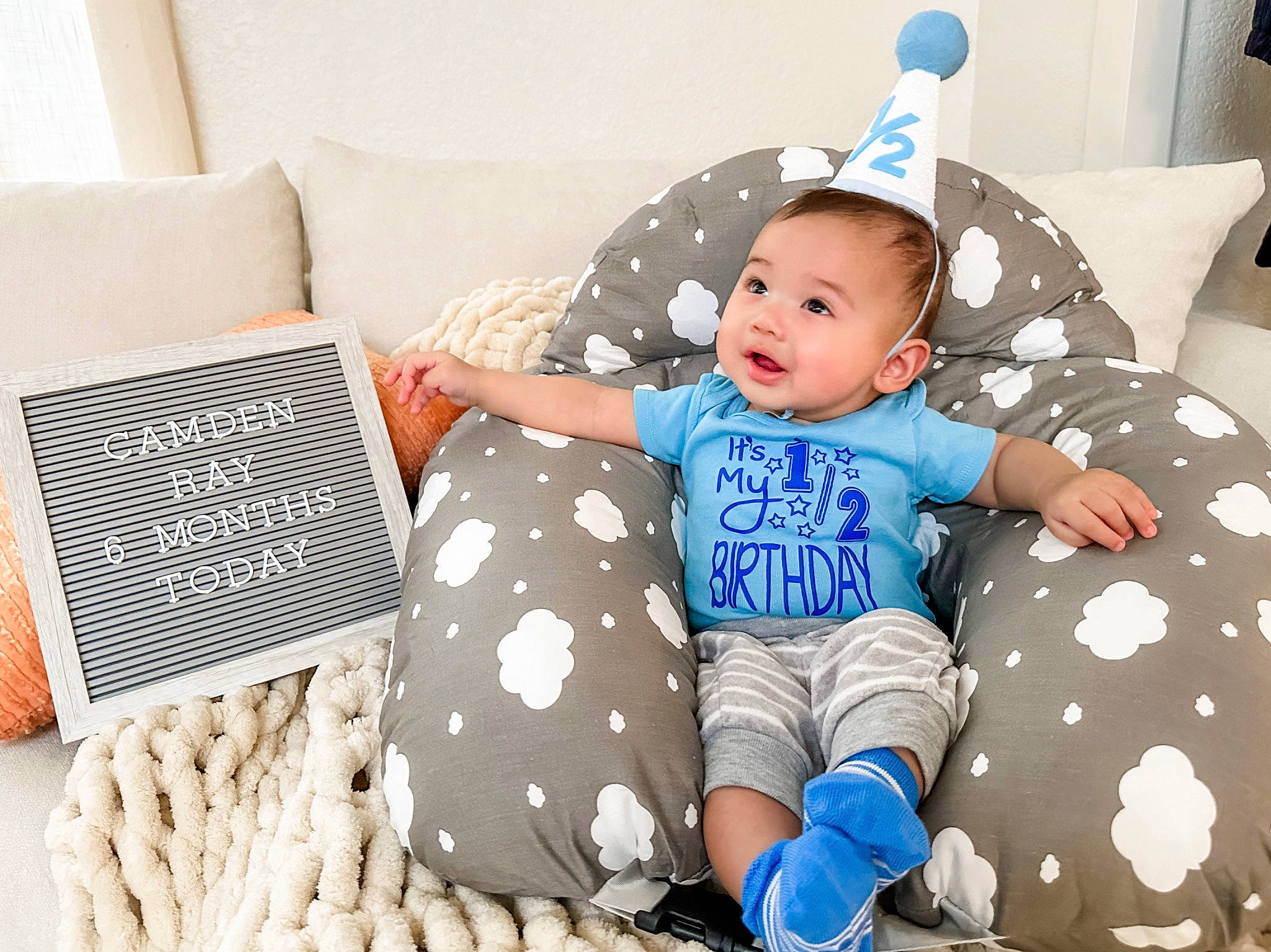 Camden joined the competition — help win amazing prizes! azure, baby, baby_sleeping, baby_toddler_clothing, bedding, blue, child, comfort, happy, linens, pattern, person, room, sitting, sleeve, smile, sock, textile, throw_pillow, toddler